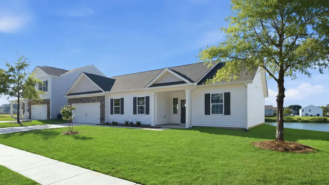 Front exterior of a new home in Tyler - Home on the Lake, New Bern, NC, highlighting curb appeal (Image 22).
