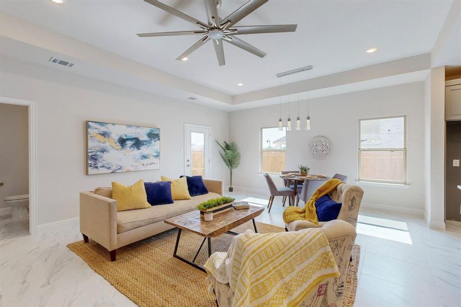 Tiled living room with ceiling fan