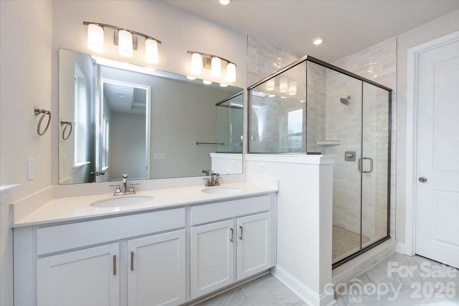 Dual Vanity Primary Bathroom with Walk-In Tiled Shower Dual Vanity Primary Bathroom with Walk-In Tiled Shower