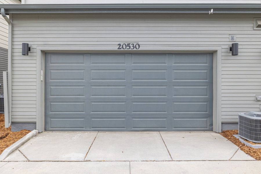 Front exterior of a new home in Painted Prairie, Aurora, CO, highlighting curb appeal (Image 26).