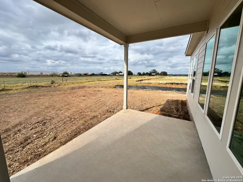 Exterior details and patio area of a home in , Castroville (Image 2).