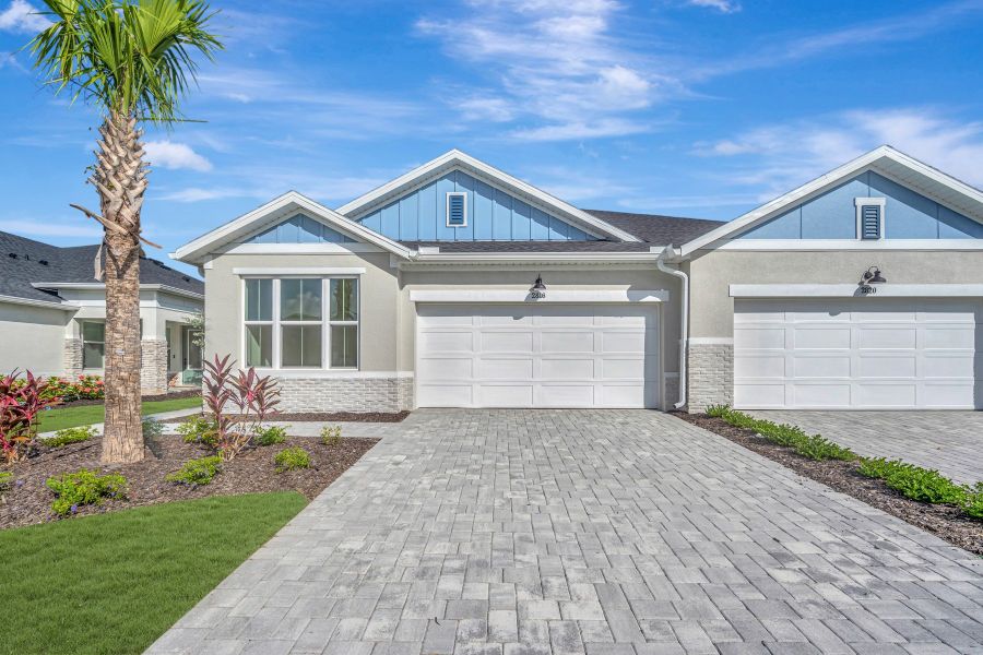 Front exterior of a new home in Gracewater at Sarasota, Sarasota, FL, highlighting curb appeal (Image 1). Front exterior of a new home in Gracewater at Sarasota, Sarasota, FL, highlighting curb appeal (Image 1).