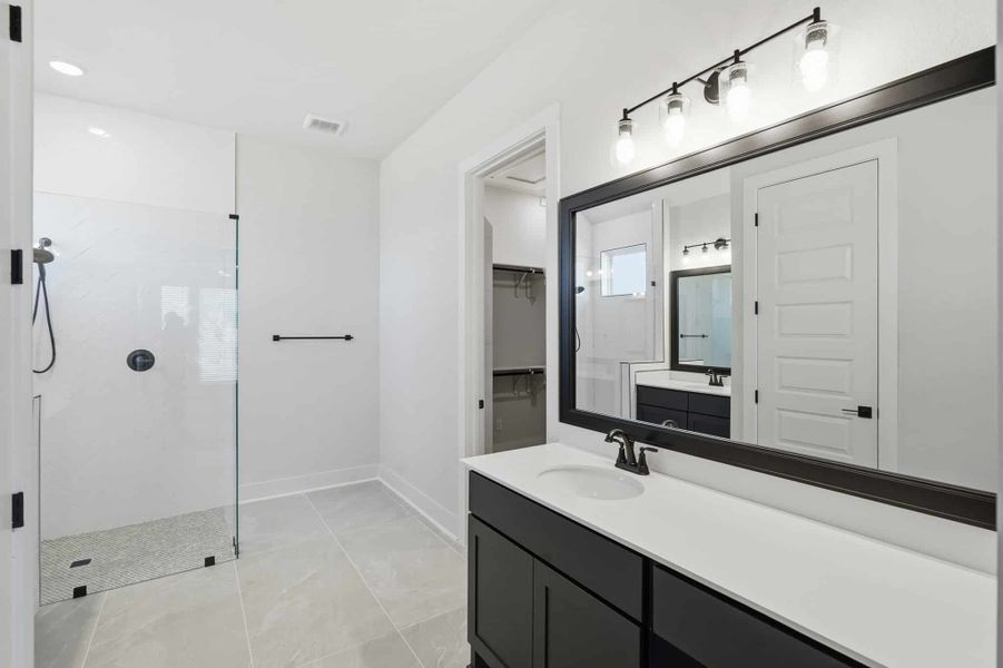 Representative furnished interior of a home built from the Mackenzie by Chesmar Homes in Sienna Lakes, San Antonio (Image 7).