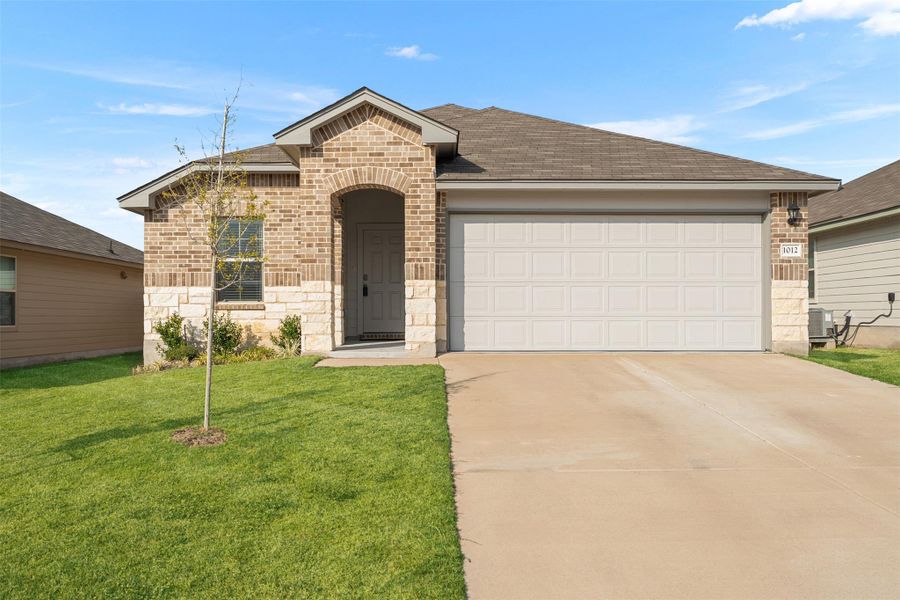 Front exterior of a new home in , Troy, TX, highlighting curb appeal (Image 1).