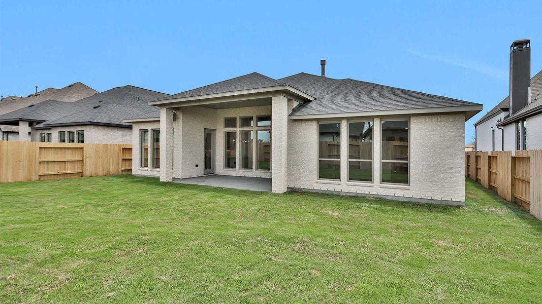 Front exterior of a new home in Grange 60', Katy, TX, highlighting curb appeal (Image 2). Front exterior of a new home in Grange 60', Katy, TX, highlighting curb appeal (Image 2).