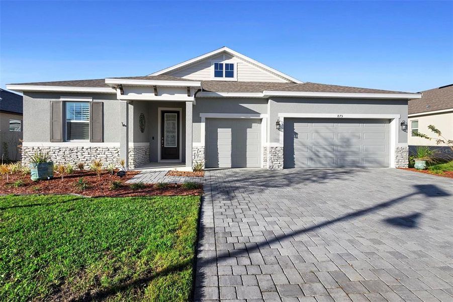 Front exterior of a new home in Addison Landing, Deland, FL, highlighting curb appeal (Image 21).
