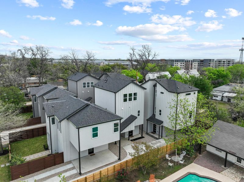 Crisp modern vertical siding and clean rooflines define this contemporary multi-level residential development.