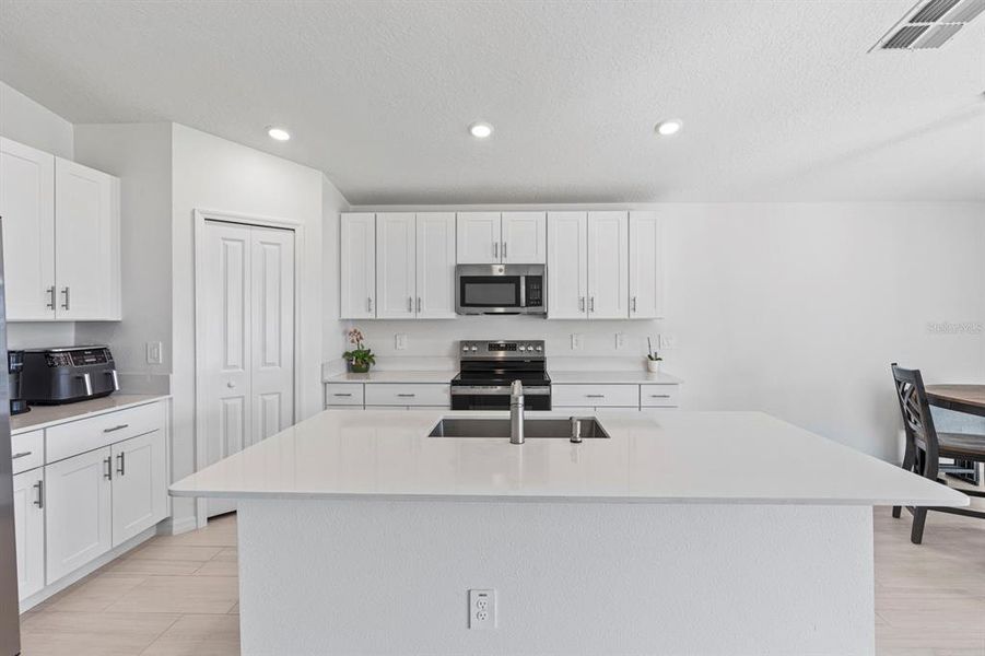 Furnished interior view inside a new home in North Park Isle: The Estates II, Plant City (Image 19). Furnished interior view inside a new home in North Park Isle: The Estates II, Plant City (Image 19).