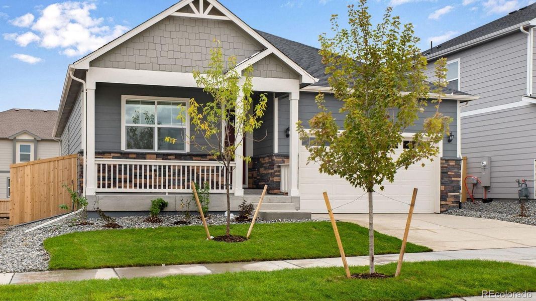 Front exterior of a new home in Trails at Crowfoot, Parker, CO, highlighting curb appeal (Image 26).