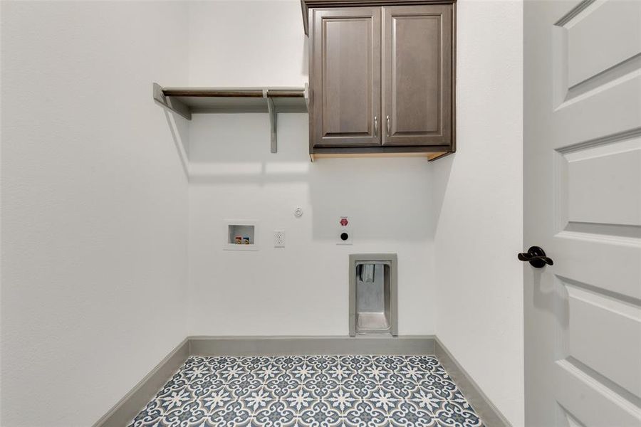 Laundry room with washer hookup, hookup for a gas dryer, tile patterned flooring, and hookup for an electric dryer