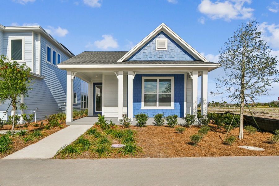 Front exterior of a new home in Weslyn Park in Sunbridge 34', St. Cloud, FL, highlighting curb appeal (Image 2). Front exterior of a new home in Weslyn Park in Sunbridge 34', St. Cloud, FL, highlighting curb appeal (Image 2).
