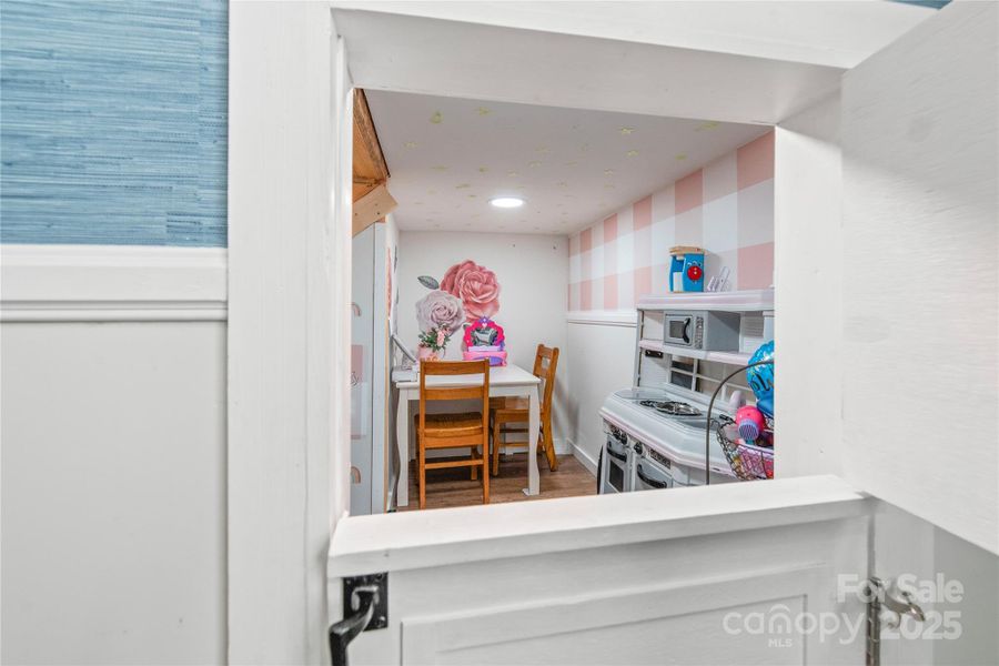 Play area under the stairs with split door