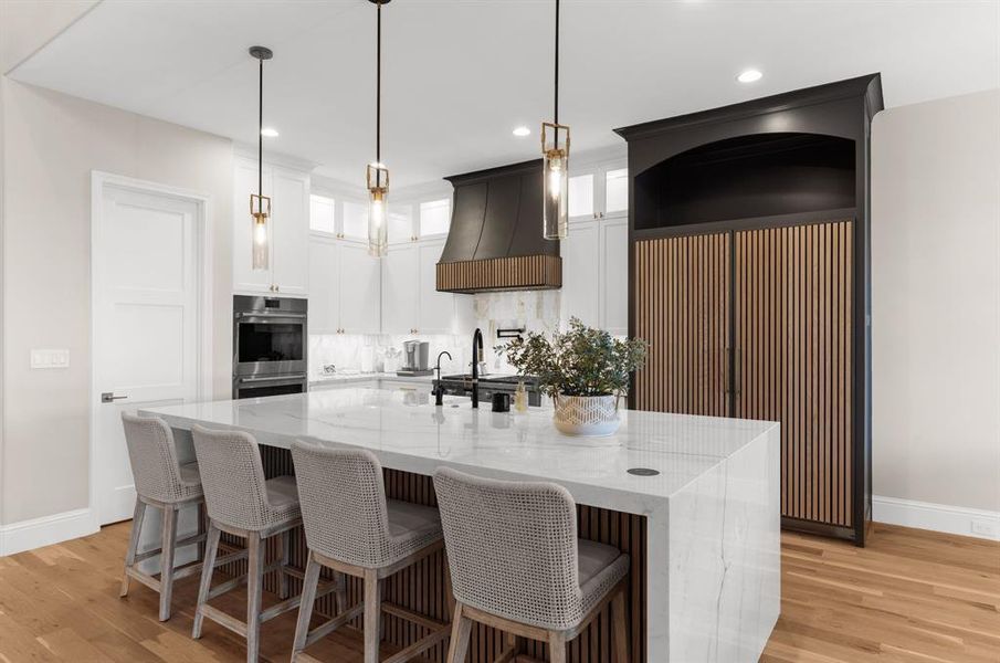 Luxurious kitchen with waterfall island Luxurious kitchen with waterfall island