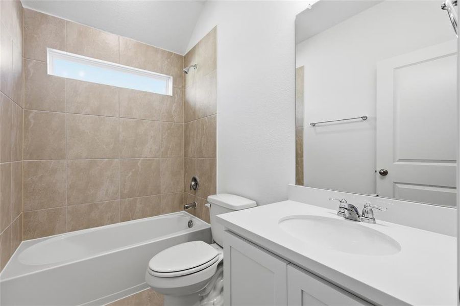Bathroom featuring vanity and shower / bathtub combination
