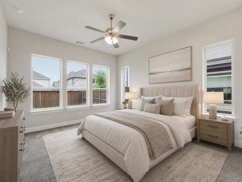 Bright bedroom featuring a multi-pane window array, recessed lighting, and a ceiling fan