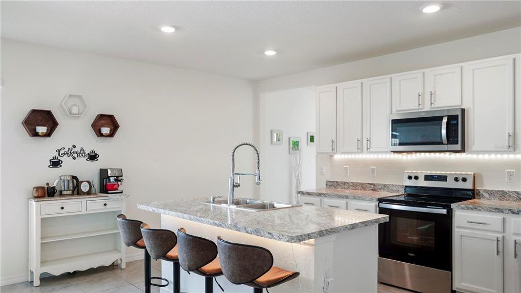 Furnished interior view inside a new home in Charles Cove Express, Davenport (Image 8).