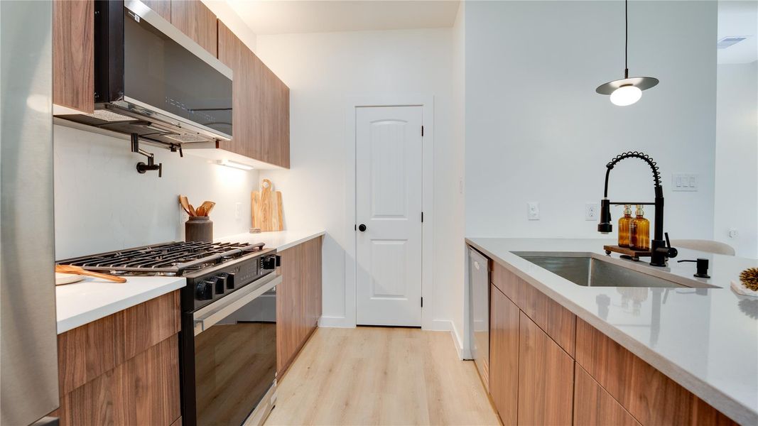 Wood cabinetry, quartz countertops