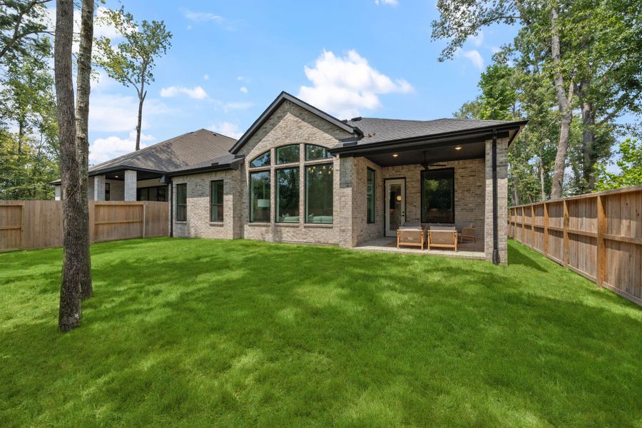 Exterior details and patio area of a home in The Highlands, Porter (Image 24).