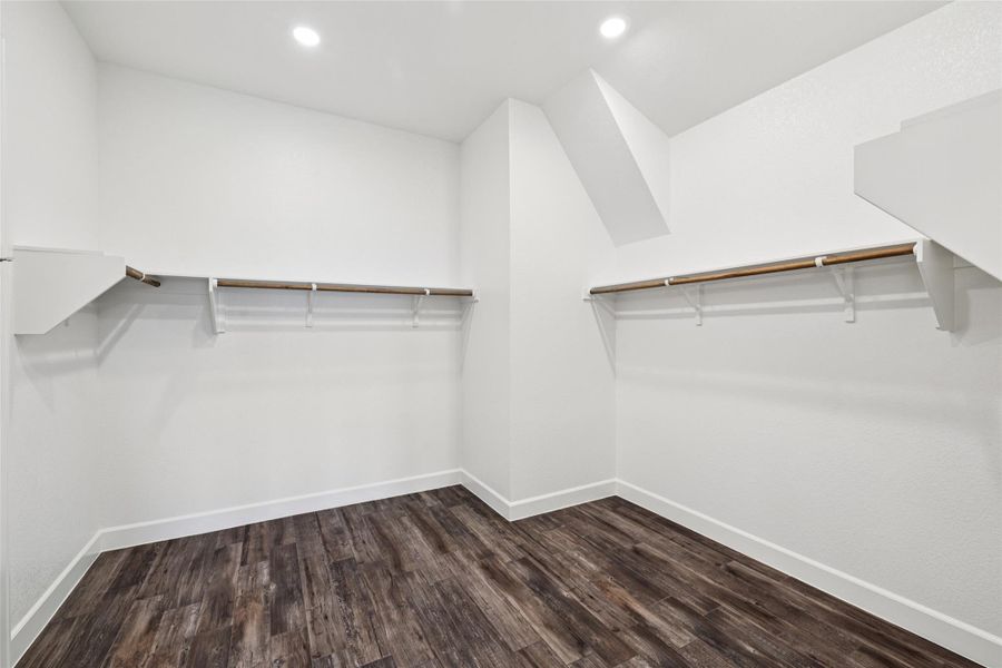 Walk in closet featuring wood finished floors