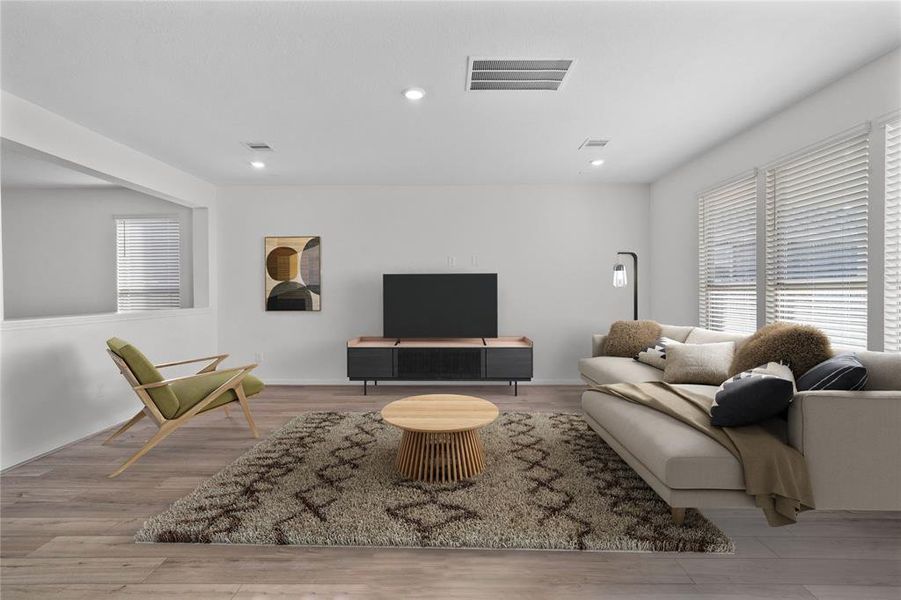 Gather the family and guests together in your lovely family room! Featuring high ceilings, recessed lighting, neutral paint, gorgeous flooring and large windows that provide plenty of natural lighting throughout the day.