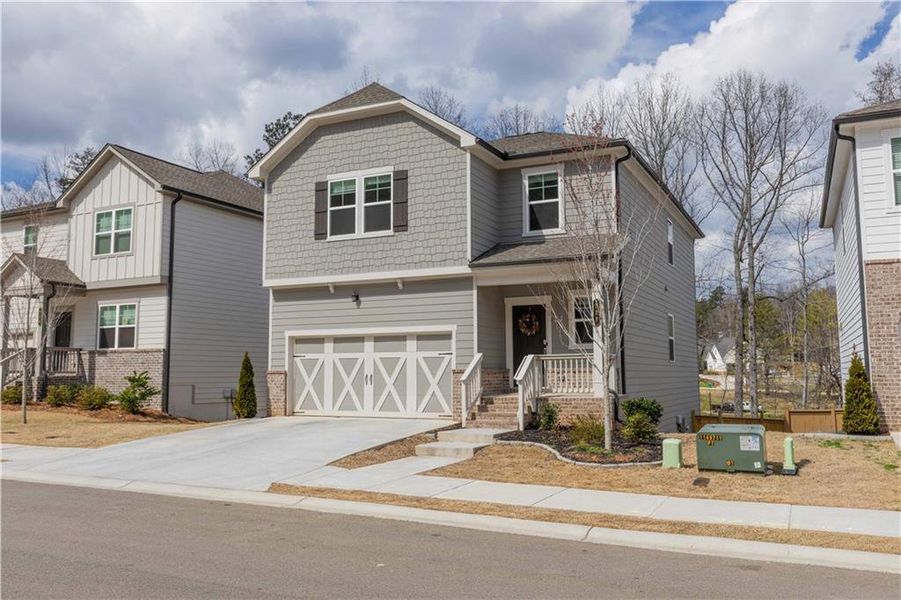 Front exterior of a new home in Creekside at Farmers Crossing, Ball Ground, GA, highlighting curb appeal (Image 22).