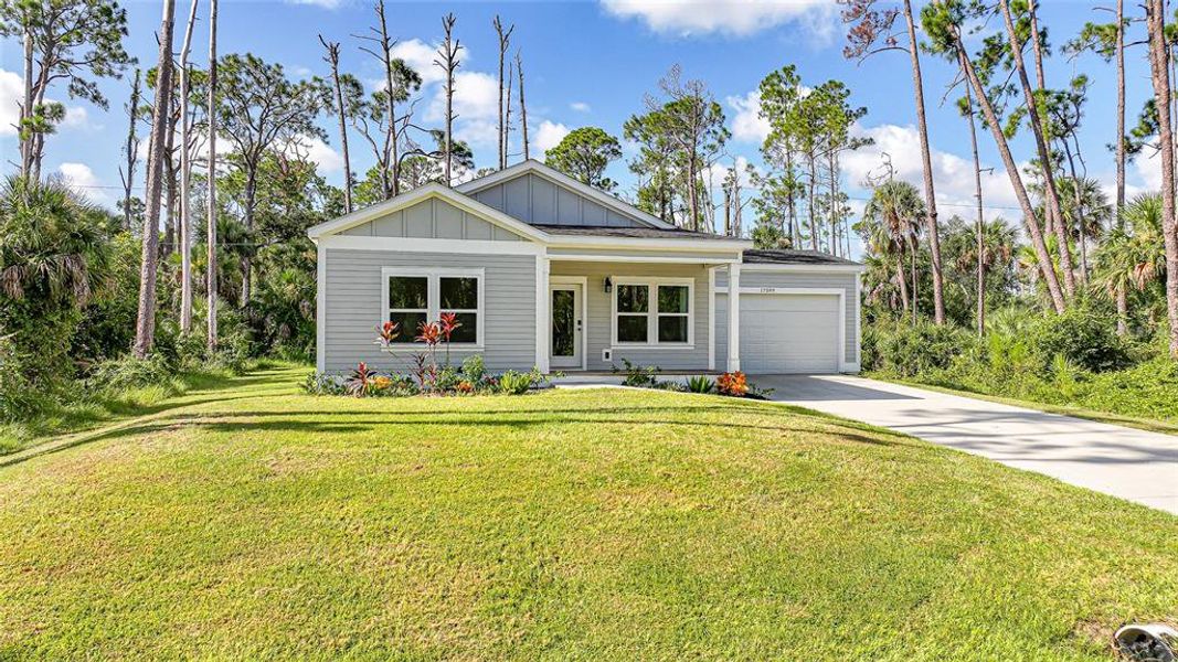 Front exterior of a new home in , Port Charlotte, FL, highlighting curb appeal (Image 19).