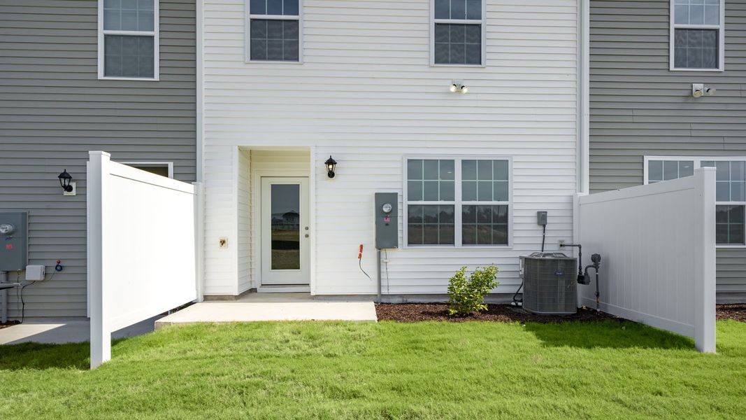 Exterior details and patio area of a home in The Townes at Prestleigh, Wake Forest (Image 4). Exterior details and patio area of a home in The Townes at Prestleigh, Wake Forest (Image 4).