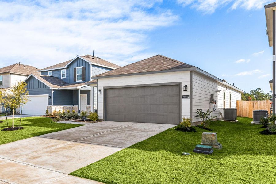 Front exterior of a new home in Northpark South, Porter, TX, highlighting curb appeal (Image 1). Front exterior of a new home in Northpark South, Porter, TX, highlighting curb appeal (Image 1).