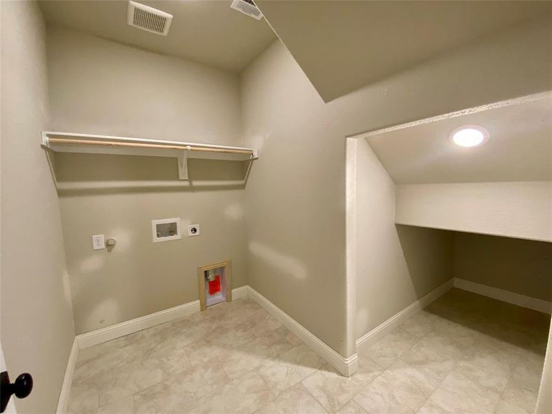 Large separate utility room with extra storage space under the stairs Large separate utility room with extra storage space under the stairs