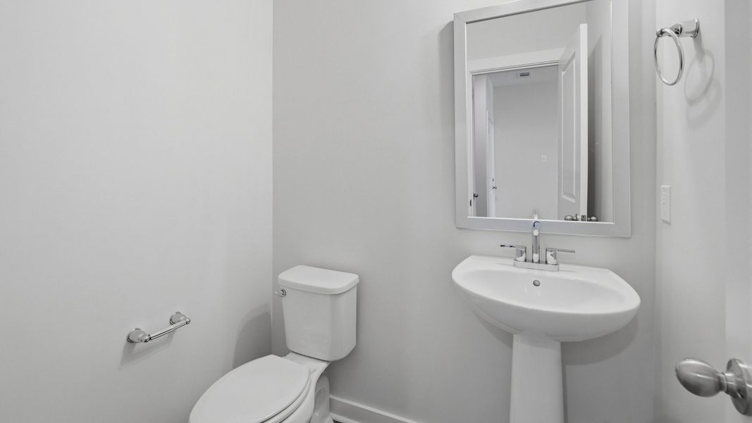 Bathroom with mirror above sink