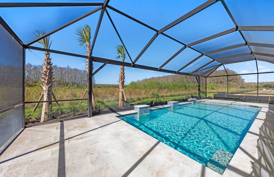 Exterior details and patio area of a home in Del Webb Naples, Ave Maria (Image 3). Exterior details and patio area of a home in Del Webb Naples, Ave Maria (Image 3).