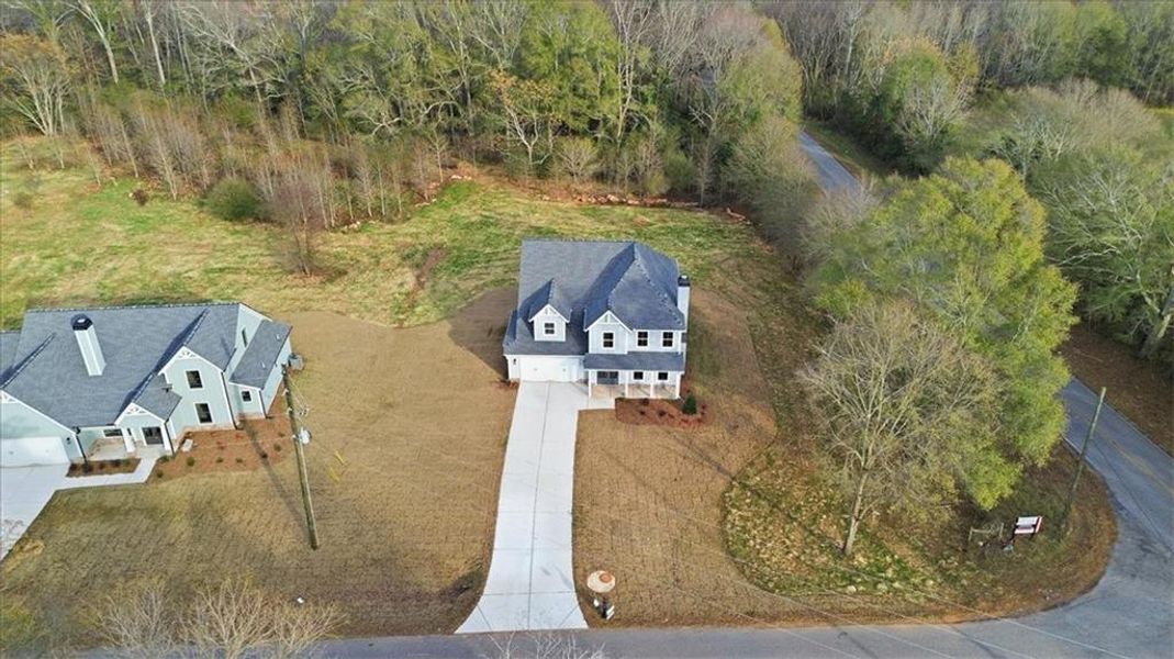 Front exterior of a new home in , Statham, GA, highlighting curb appeal (Image 2). Front exterior of a new home in , Statham, GA, highlighting curb appeal (Image 2).