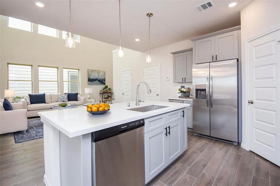 Notice the expansive island offering ample countertop space perfect for meal preparation. Notice the expansive island offering ample countertop space perfect for meal preparation.
