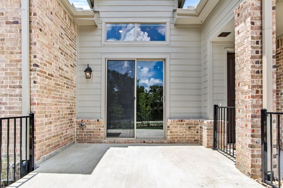 Exterior details and patio area of a home in Cottonwood Creek, Rowlett (Image 29).