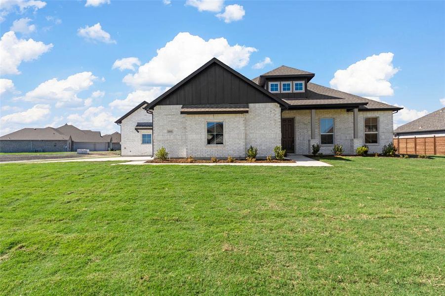 View of front of house with a front lawn