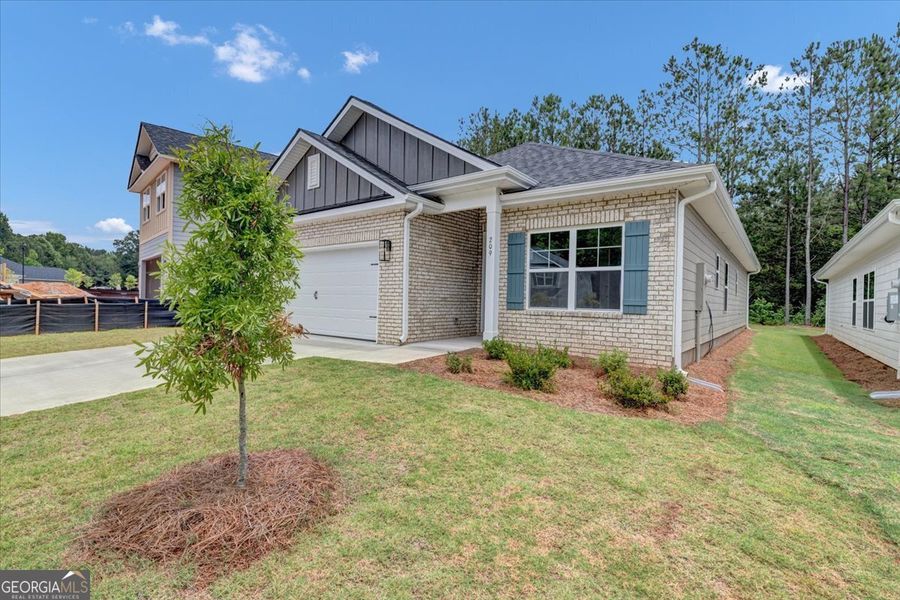 Front exterior of a new home in Canterbury Villas, Carrollton, GA, highlighting curb appeal (Image 21). Front exterior of a new home in Canterbury Villas, Carrollton, GA, highlighting curb appeal (Image 21).