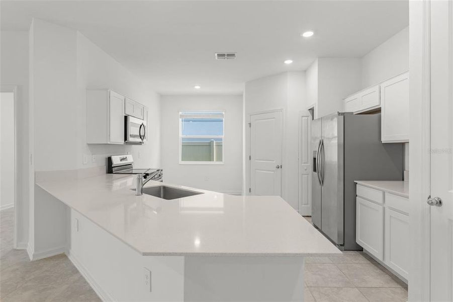Furnished interior view inside a new home in Peace Creek Reserve, Winter Haven (Image 6).