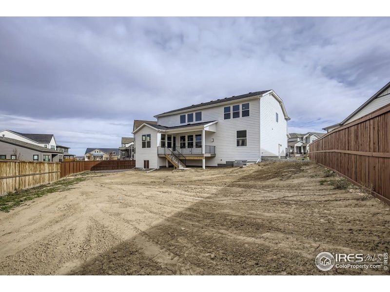 Exterior details and patio area of a home in RainDance National 60/70, Windsor (Image 4).