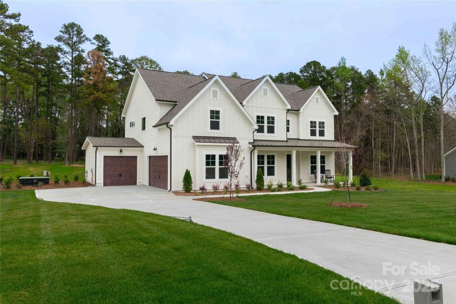 Front exterior of a new home in , Matthews, NC, highlighting curb appeal (Image 25). Front exterior of a new home in , Matthews, NC, highlighting curb appeal (Image 25).