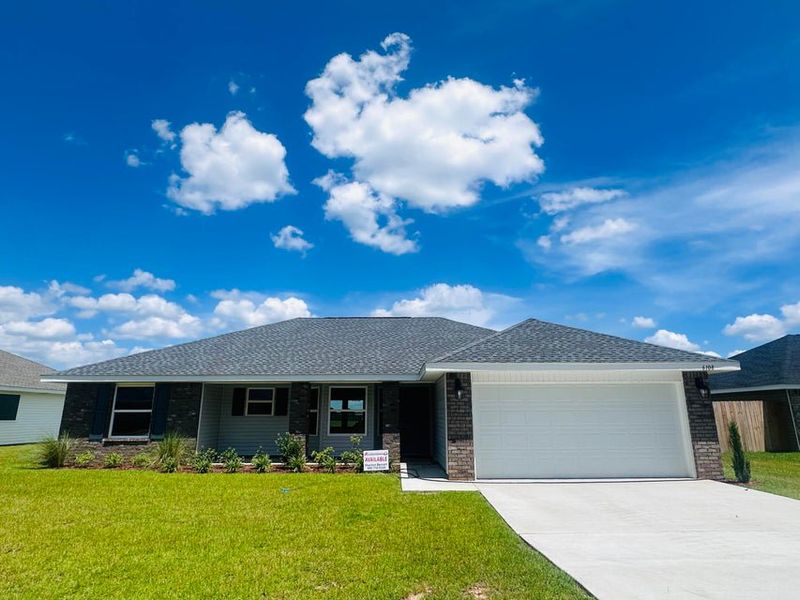 Front exterior of a new home in Ashton View, Crestview, FL, highlighting curb appeal (Image 1).