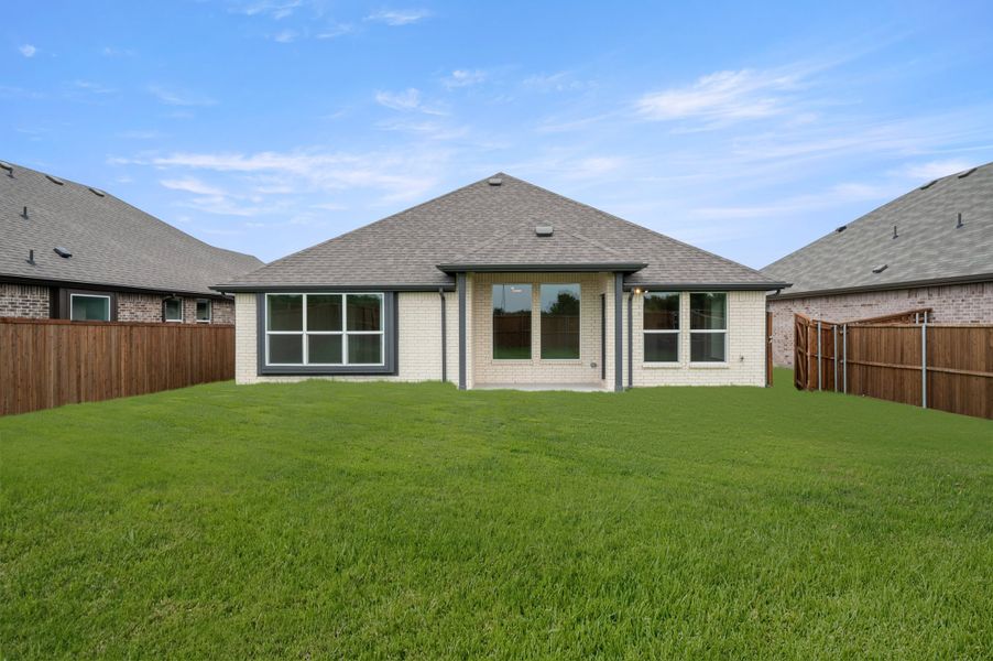 Exterior details and patio area of a home in Meadow Park at The Meadows, Ponder (Image 4).