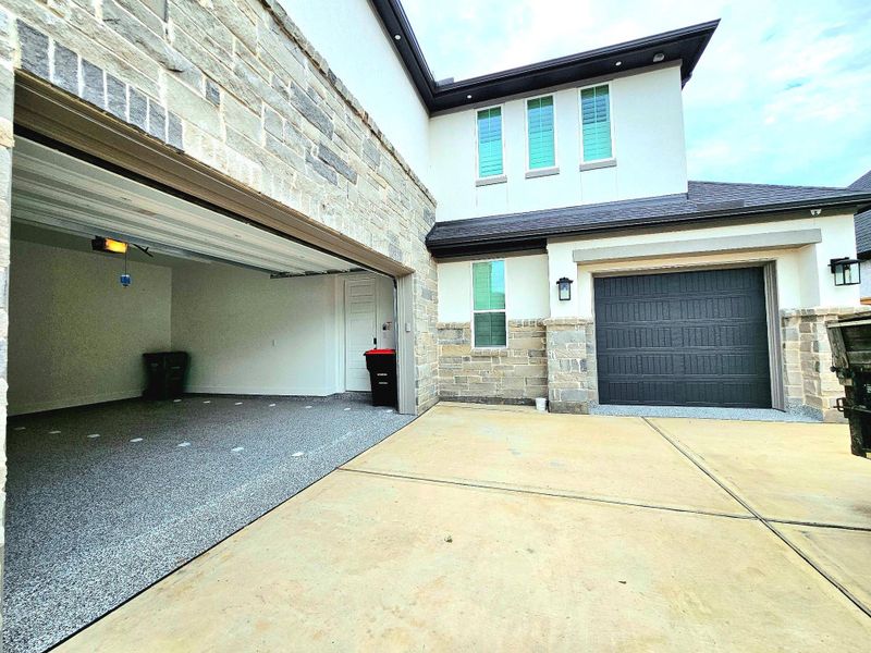 This home features a spacious two-car garage on the left and a single-car garage on the right, perfect for storing a golf cart in our golf course community. This home features a spacious two-car garage on the left and a single-car garage on the right, perfect for storing a golf cart in our golf course community.