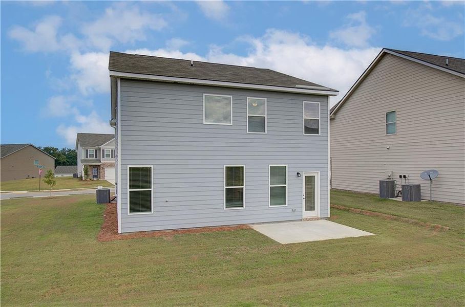 Exterior details and patio area of a home in Enclave at Evergreen, Fairburn (Image 3).