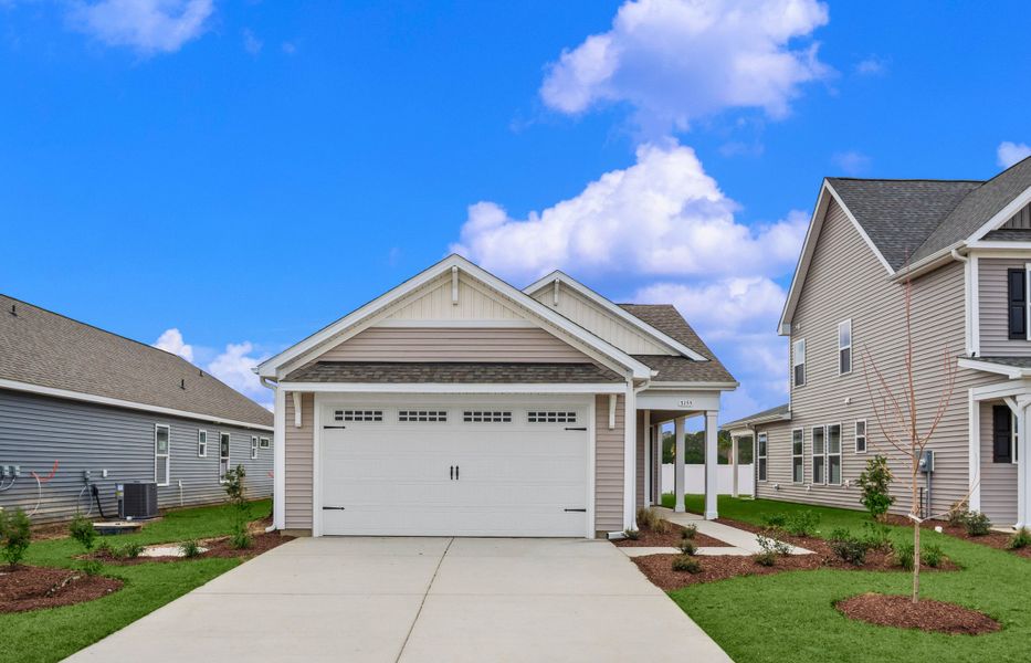 Front exterior of a new home in Coastal Club of the Carolinas, Calabash, NC, highlighting curb appeal (Image 17).