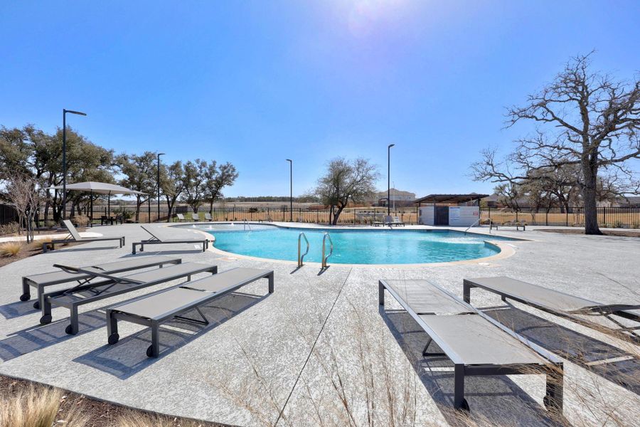 Community pool with a patio.