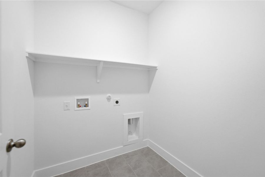 Laundry area featuring hookup for a gas dryer, washer hookup, and hookup for an electric dryer