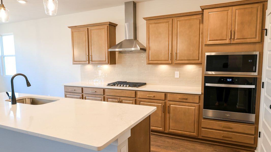 Representative furnished interior of a home built from the STONEBROOK II by D.R. Horton in Harvest Point, Spring Hill (Image 8).