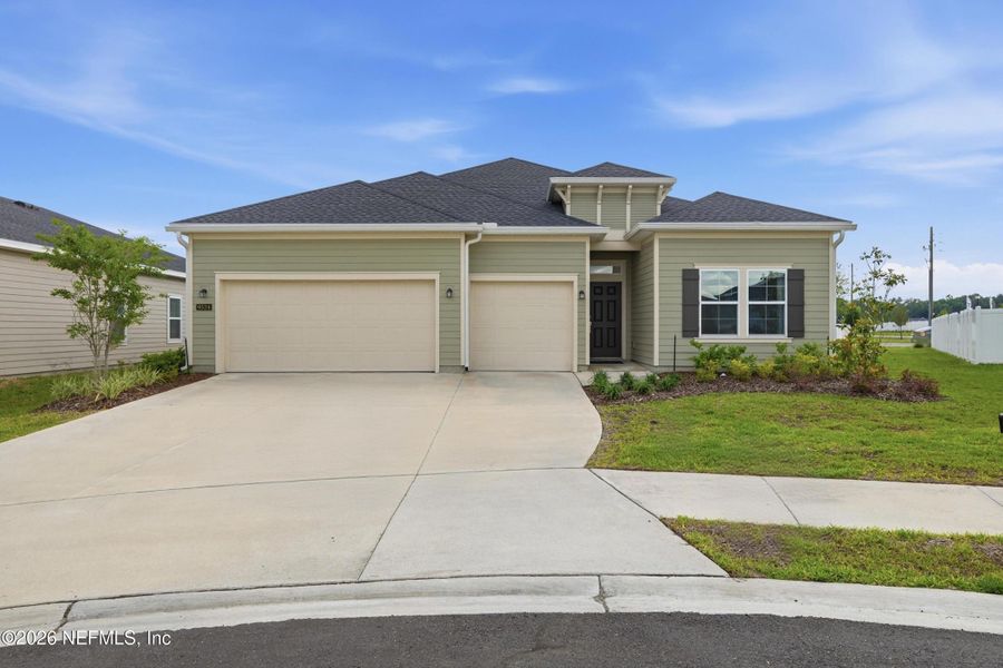 Front exterior of a new home in Saddle Oaks, Jacksonville, FL, highlighting curb appeal (Image 25). Front exterior of a new home in Saddle Oaks, Jacksonville, FL, highlighting curb appeal (Image 25).