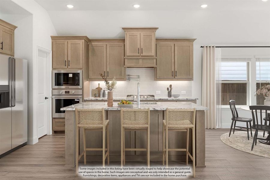 Kitchen with tan wood cabinets, center island with marble countertop, three bar stools, and stainless steel appliances Kitchen with tan wood cabinets, center island with marble countertop, three bar stools, and stainless steel appliances