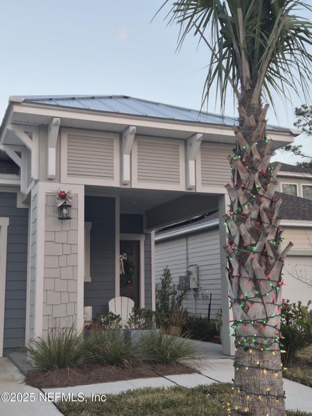 Exterior details and patio area of a home in Condo Collection at Grand Vue at Interlocken, Fernandina Beach (Image 4).